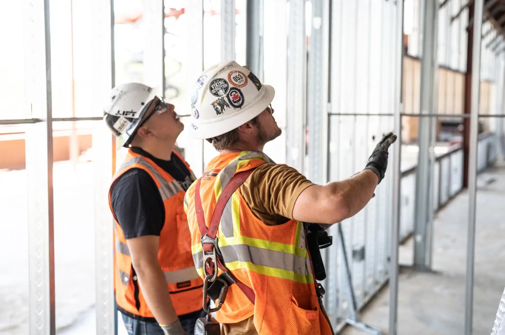 South Pointe team reviewing plans at industrial worksite